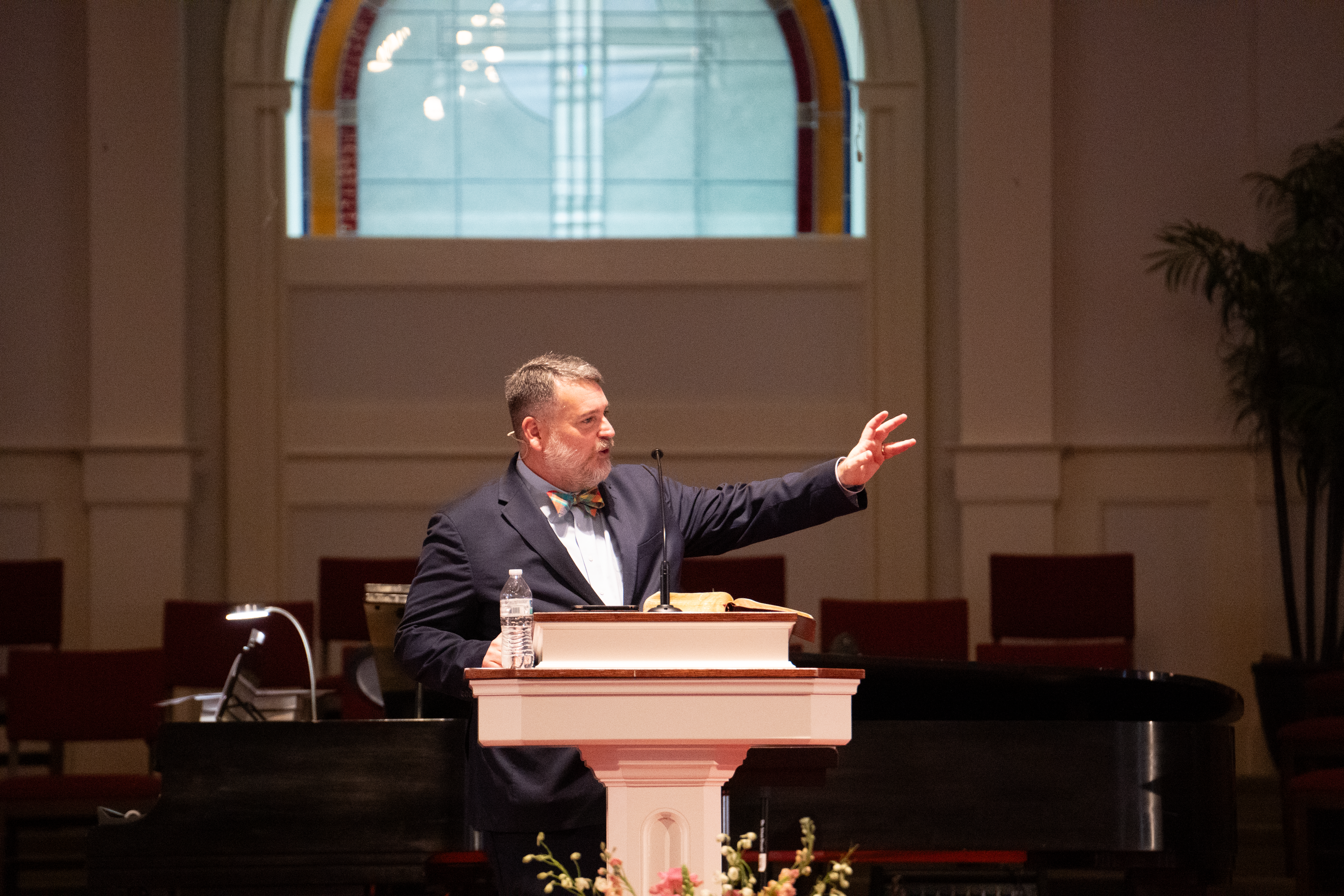 Bro. Tommy Fike preaches behind pulpit at Dalraida Baptist Church