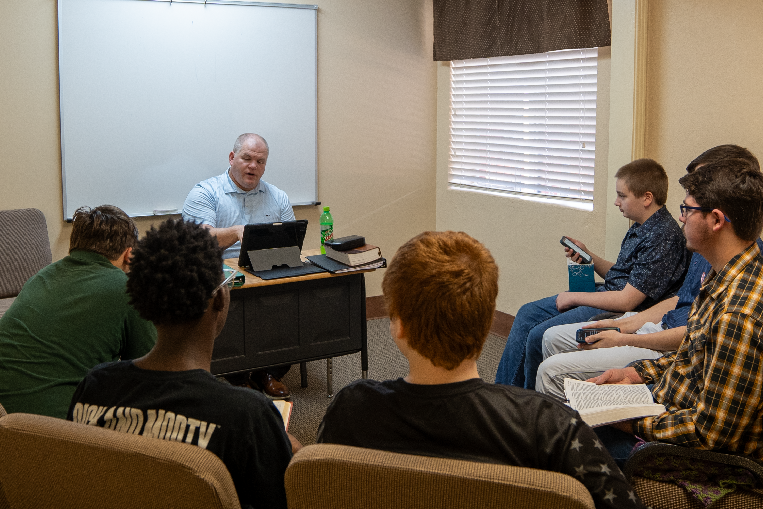 Teen guys have a discussion in their Sunday School class